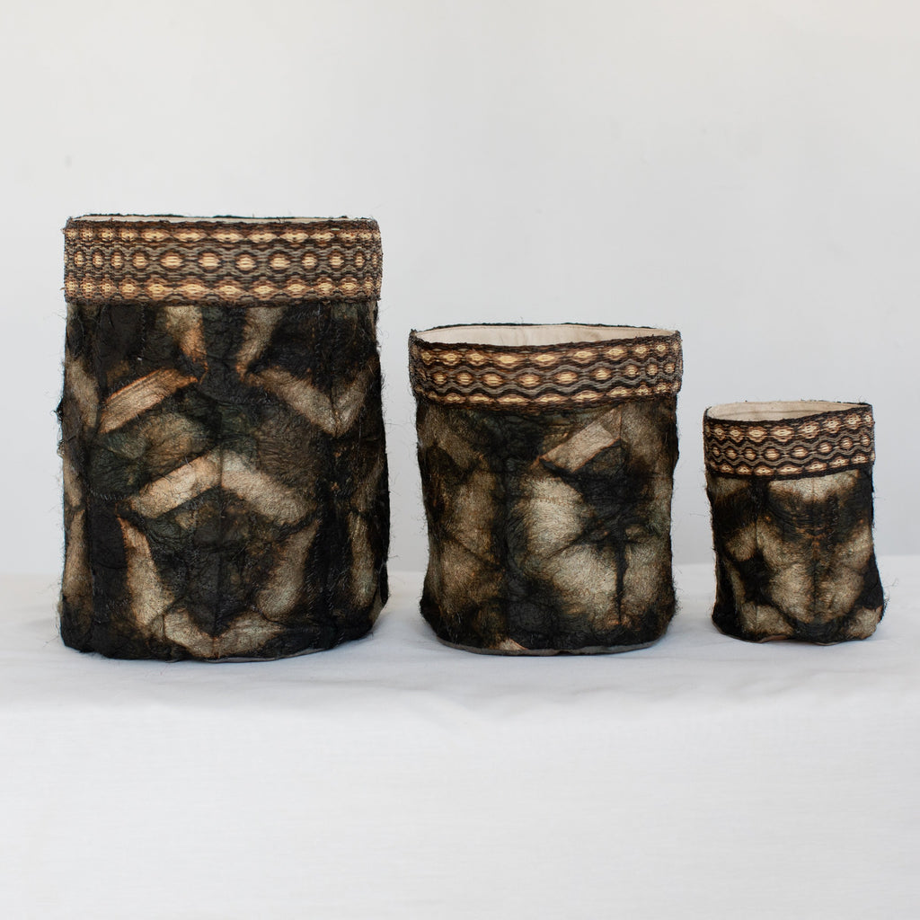 Handmade fair trade decorative basket, black onyx, gold, tan , shibori hexagon pattern, silk and raffia, made in Madagascar.