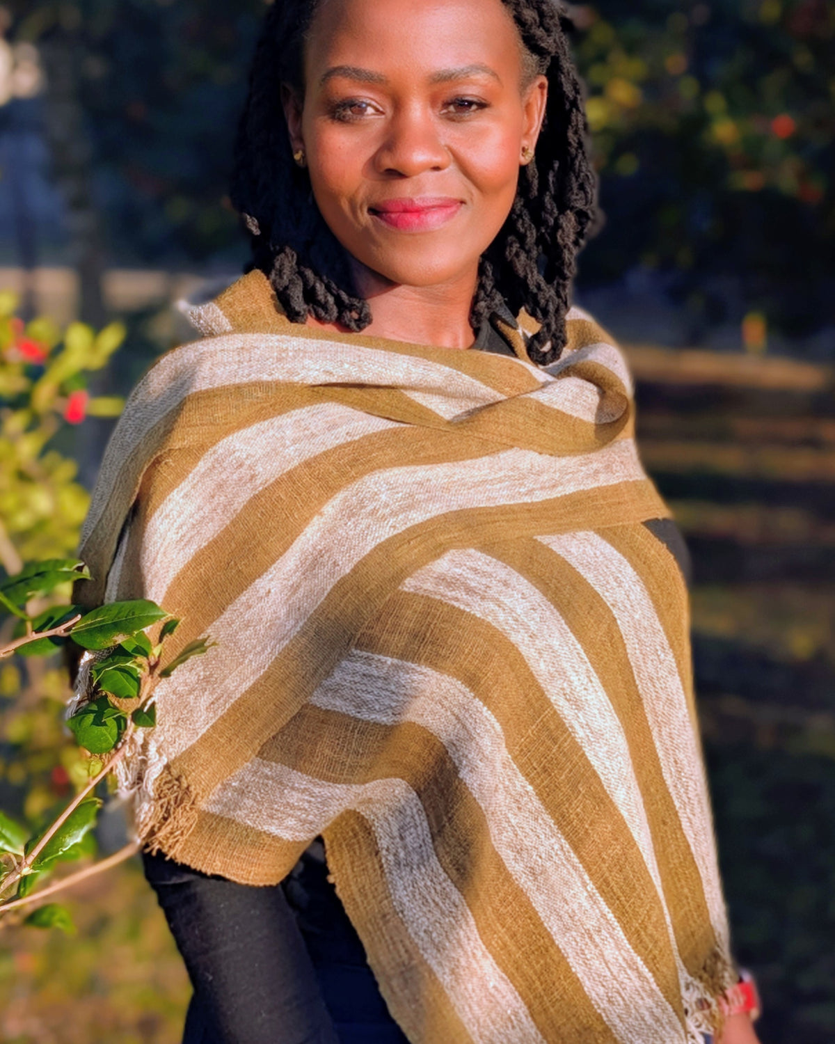 Handwoven Madagascar wild silk scarf. Olive green and white stripe. Naturally dyed, handmade, fair trade, and wildlife friendly.