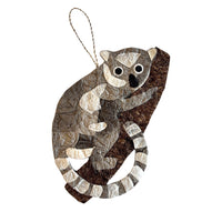 Handmade silk ornament depicting baby ring-tailed lemur.  Perfect gift for an animal-lover.  Made from sustainably sourced raffia fiber and silk cocoons.  Fair trade certified.  Made in Madagascar.