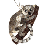 Handmade silk ornament depicting baby ring-tailed lemur.  Perfect gift for an animal-lover.  Made from sustainably sourced raffia fiber and silk cocoons.  Fair trade certified.  Made in Madagascar.