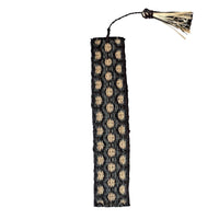 Handwoven raffia bookmark with pattern of charcoal, black, and light tan. Fair trade, handmade, sustainably sourced raw materials. Great gift for a man or woman.