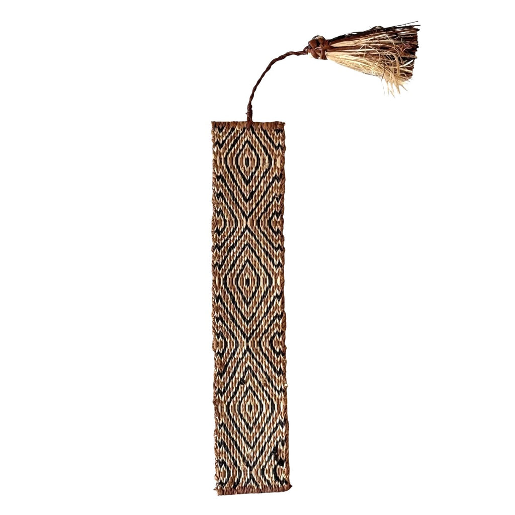 Handwoven raffia bookmark with pattern of rich brown, black, and light tan. Fair trade, handmade, sustainably sourced raw materials.