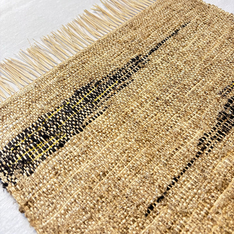 Handwoven handmade Madagascar wild silk + raffia placemats, set of 2, black and gold tan linen-colored chevron zigzag, textured, handwoven patterning, fair trade certified, eco-friendly, wildlife friendly home decor
