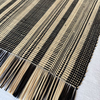 Handwoven Madagascar raffia table runner, black and natural linen-colored stripe, handwoven patterning, Betsimisaraka stripe pattern, fair trade eco-friendly wildlife friendly home decor