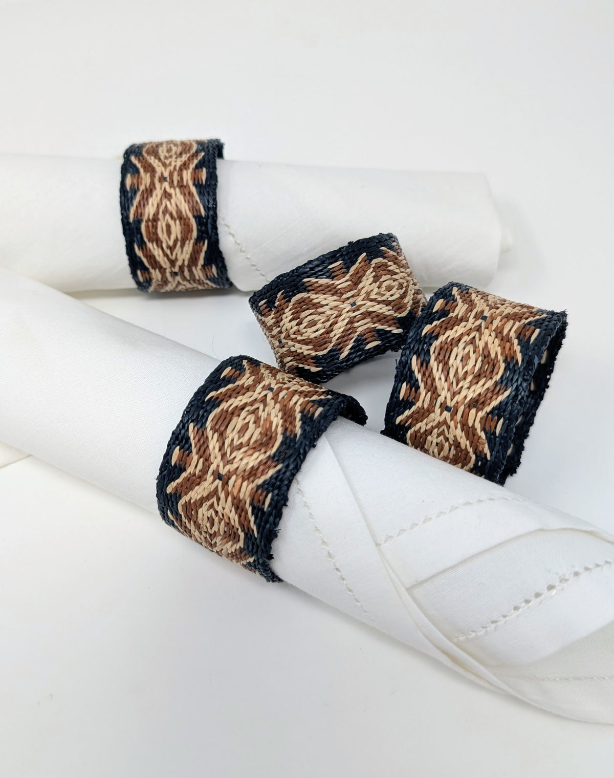 Handwoven raffia napkin ring set of 4, fair trade, wildlife friendly, ecofriendly, handmade, black brown and natural, home decor, table decor.