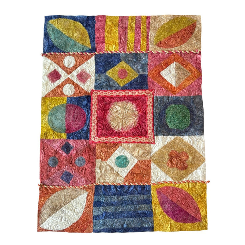 Colorful collaged textile artwork with nature-inspired geometric patterns in gold, white, blue, green, and red.  Hand-crafted, fair trade certified, sustainably sourced raw materials.  Made from Madagascar silk cocoons and cardwoven raffia.