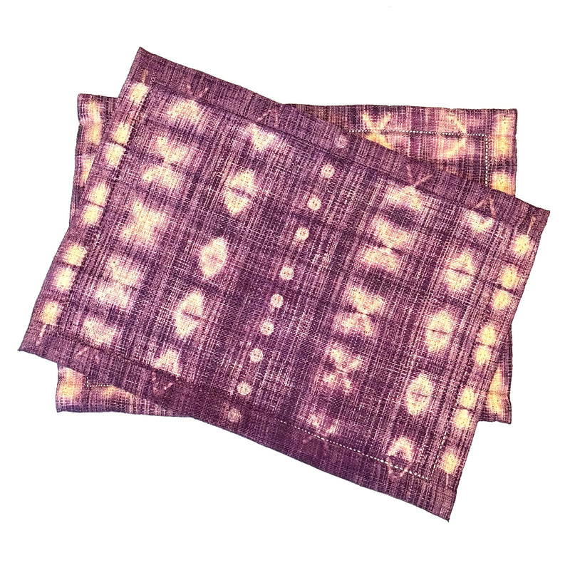 Shibori-Dyed Raffia Placemats, handmade, fair trade, boysenberry fuschia purple with light tan in an elegant pattern. Rectangle shaped, set of two.