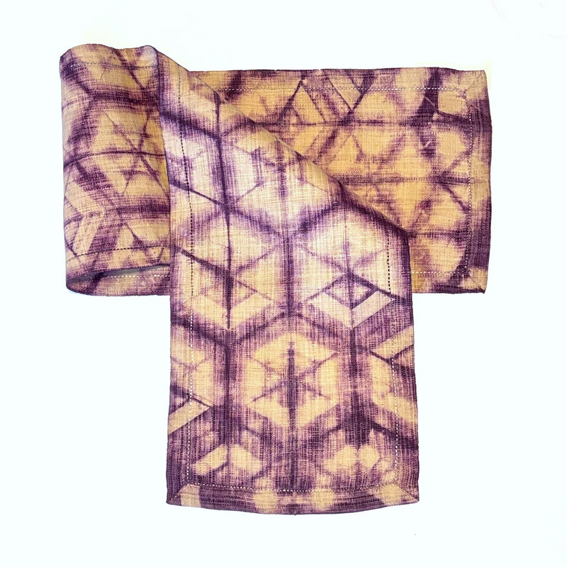 Shibori-Dyed Raffia Table Runner, handmade, fair trade, boysenberry fuschia purple with light tan in a hexagon pattern.
