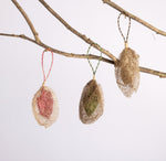 Handmade fair trade ethically sourced rainforest friendly Madagascar wild silk cocoon holiday christmas tree ornament unique silk cocoon decoration red green gold