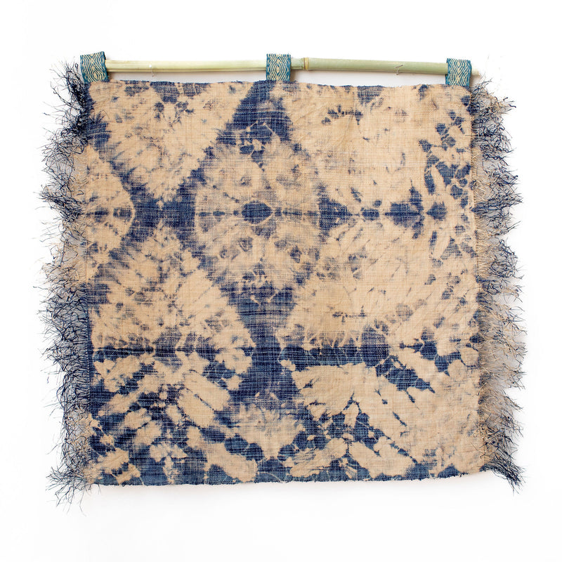 Ethically made fair trade handmade woven wall art wall hanging wall decor 24"x24" batik dyed tie-dyed Madagascar raffia denim navy indigo blue