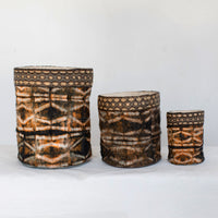 Handmade fair trade decorative basket black dark brown onyx, shibori stick pattern, silk and raffia, made in Madagascar.