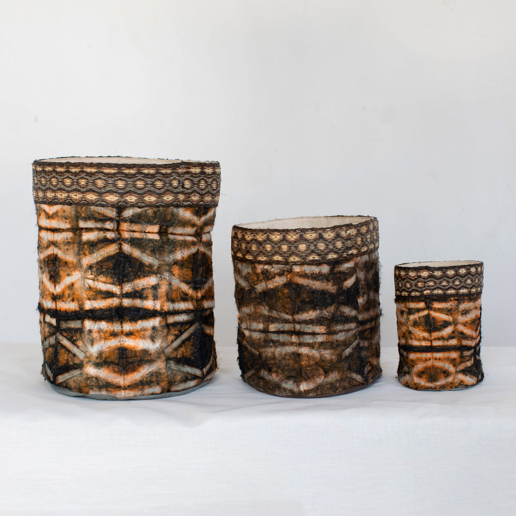 Handmade fair trade decorative basket black dark brown onyx, shibori stick pattern, silk and raffia, made in Madagascar.