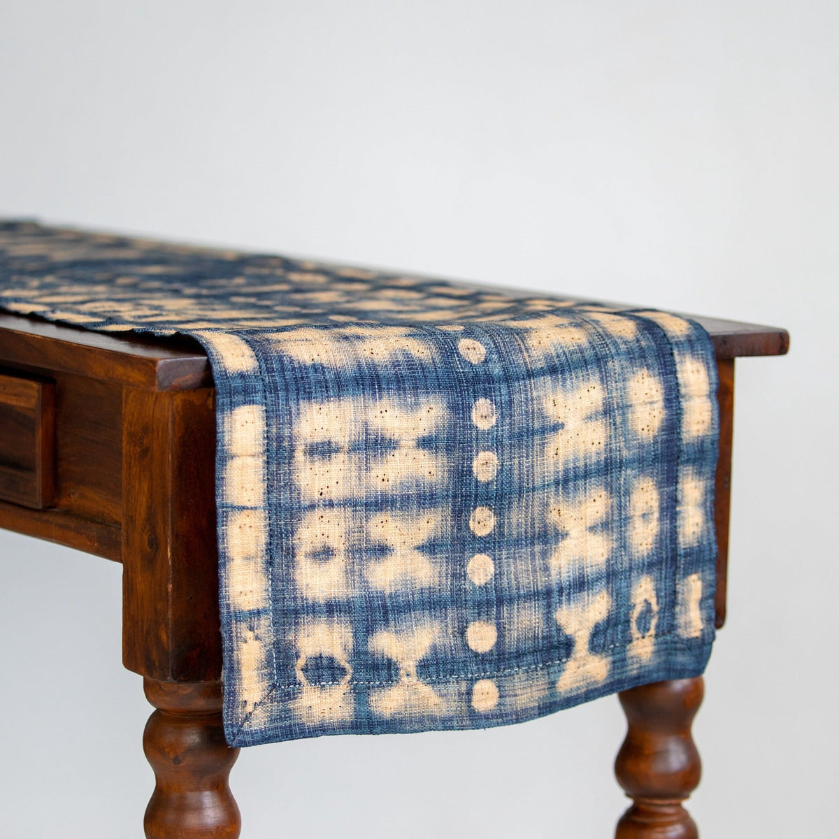 Handmade fair trade Madagascar raffia table runner indigo navy blue and natural tan ivory shibori dye pattern