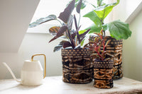 Handmade fair trade decorative basket black dark brown onyx, shibori stick pattern, silk and raffia, made in Madagascar.